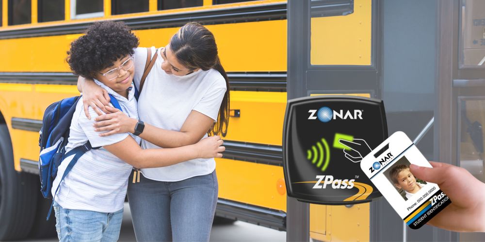 Student hugs family member before boarding the bus with new Zonar ZPass bus card
