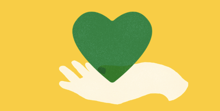 yellow background with a hand holding a green heart