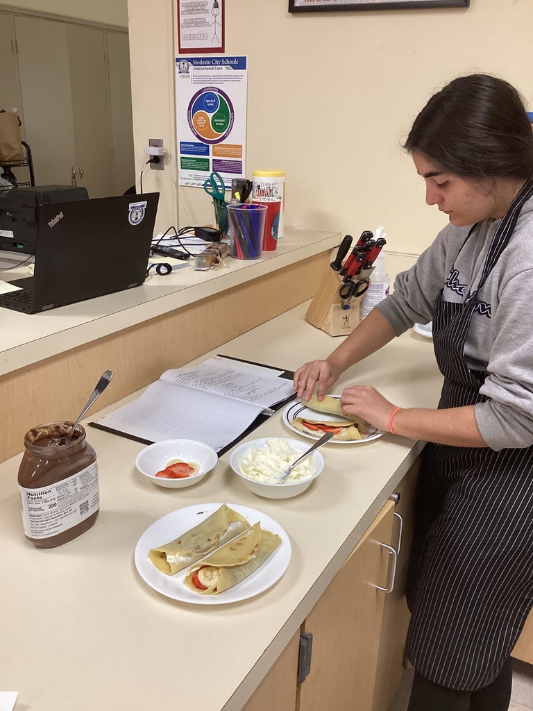student making crepes